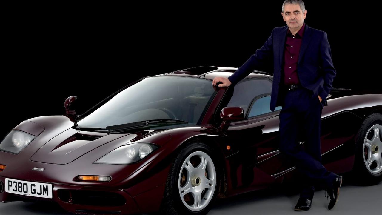 Mr Bean actor Rowan Atkinson with the McLaren F1 Supercar.