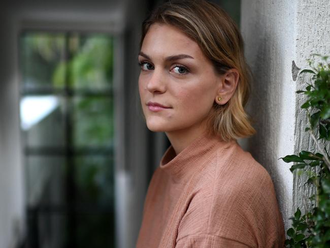 Ellen Fisher, 24, a Covid-19 survivor, poses for photos at her home in Brisbane.Picture: Dan Peled