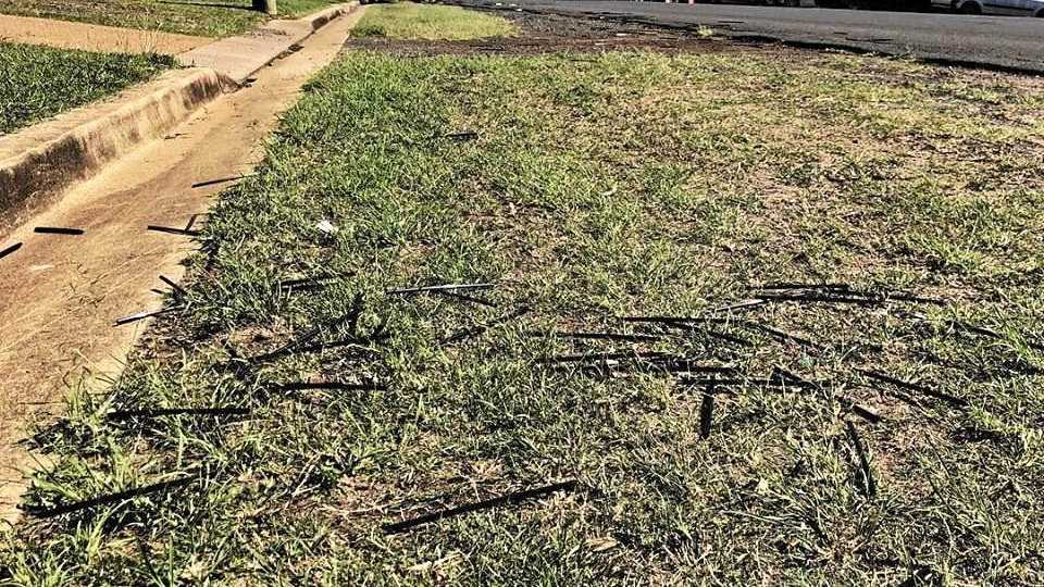 Lyla and her dad picked up at least 1000 straws that had been scattered along the road. Picture: Contributed