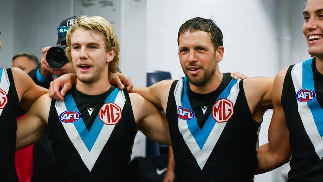 Jason Horne-Francis and Travis Boak (centre) of Port Adelaide sing the team song during the 2023 AFL Round 09 match between the North Melbourne Kangaroos and Port Adelaide. Photo: Dylan Burns/AFL Photos via Getty Images