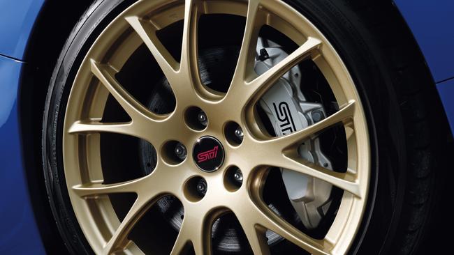 Gold wheels are classic WRX STI style.