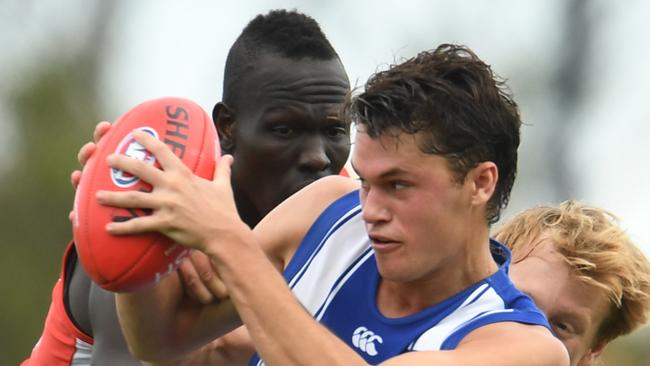 North Melbourne’s Curtis Taylor is tackled during the 2020 Marsh Community Series AFL match between the North Melbourne Kangaroos and the Sydney Swans at Kingston. Picture: STEVE BELL/GETTY IMAGES