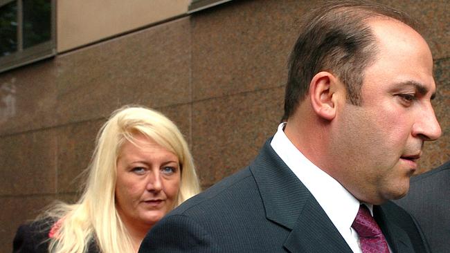15 Nov 2004 : Gangland boss, Tony Mokbel with his legal team Nicola Gobbo (left) and Con Heliotis QC (right) outside the Magistrates Court - crime Vic drugs headshot mobile phone profile