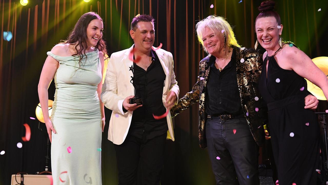 Jasmine and Chris Richter onstage receiving the award for Songwriter of the Year from ASA chairman Denny Burgess and APRA representative Nikki Tuckwell.