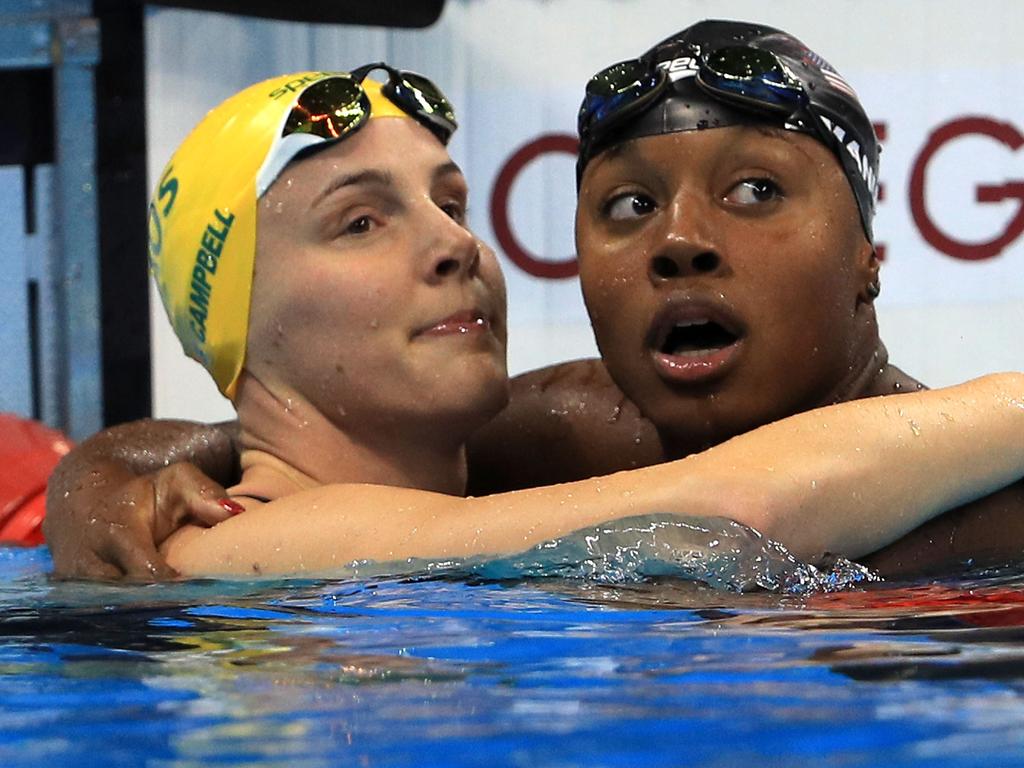 RIO DE JANEIRO, BRAZIL - AUGUST 11: Simone Manuel (R) of the United States embraces Bronte Campbell of Australia after winning gold in the Women's 100m Freestyle Final on Day 6 of the Rio 2016 Olympic Games at the Olympic Aquatics Stadium on August 11, 2016 in Rio de Janeiro, Brazil. (Photo by Mike Ehrmann/Getty Images)