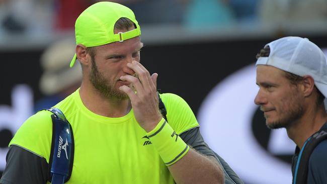 Sam Groth wipes away a tear after farewelling the Australian Open crowd.