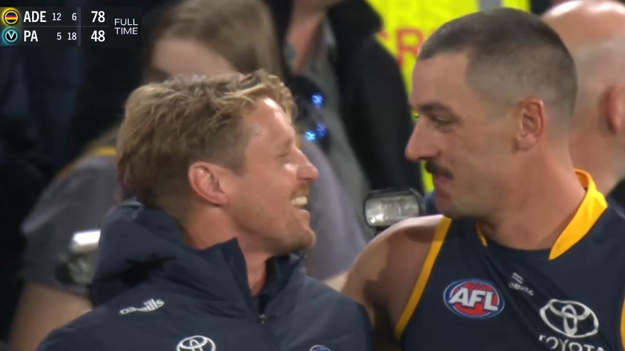 Find someone that looks at you the way Taylor Walker looks at Rory Sloane. Photo: Fox Footy