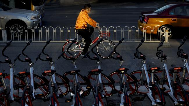 Mobike is run by a former Uber executive in China and is gaining popularity in major cities among commuters travelling either long or short distances. Picture: Andy Wong/AP