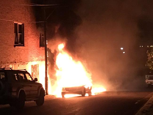 Car torched on Minnie St Belmore after the murder. Picture: Channel 9 / Twitter