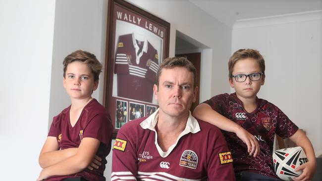 Gerard Fitzsimon (centre) with his boys Isaac, 9, (left) and Tom, 11. Picture: AAP/Steve Pohlner