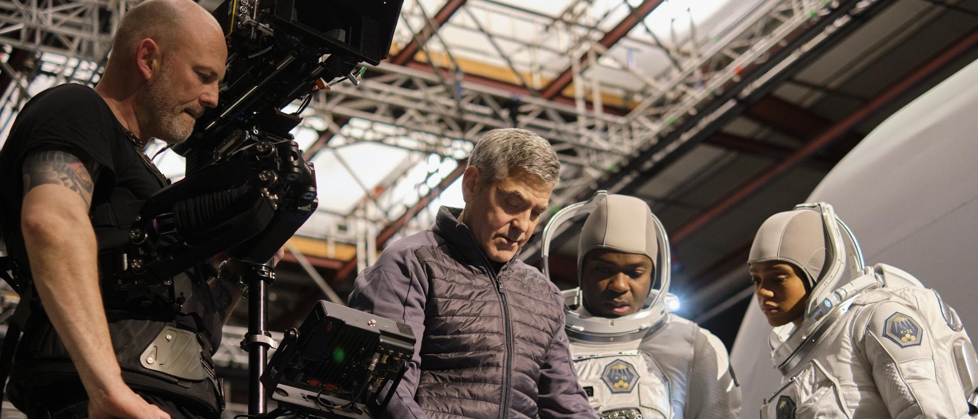 In charge … director George Clooney at Shepperton Studios with David Oyelowo and Tiffany Boone on the set of The Midnight Sky. Picture: Netflix