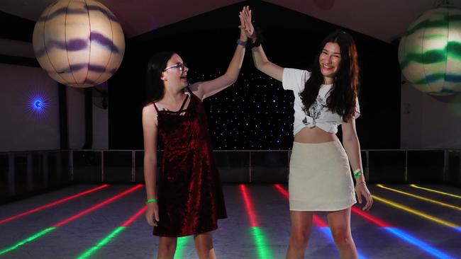 Sisters Layla Warner 13 and Aaliyah Stafford get their skates on to take advantage of Play Money at Planet Chill Ice-Skating Rink at Surfers Paradise. Picture: Glenn Hampson