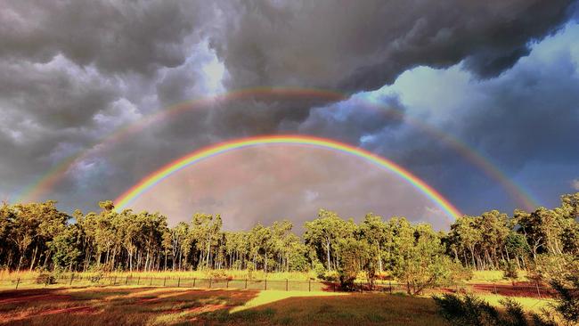 A stunning double rainbow emerges in the sky above Howard Springs. Picture: Zoe Cooper