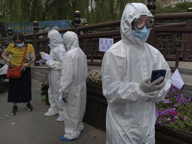 Chinese epidemic control workers in Beijing. Picture: Getty