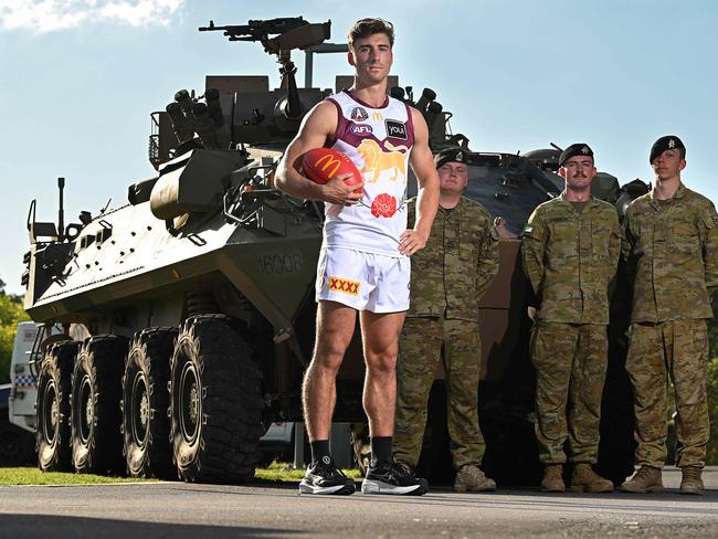 Noah Answerth with an Army ASLAV and troops at the Brighton Homes Arena, Springfield. Picture: Lyndon Mechielsen/Courier Mail