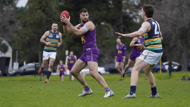 David Mirra takes a mark against St Kevins. Picture: Valeriu Campan