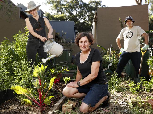 Erskineville locals (from left) Bek Clayton, Julie Moffat and Andrew Chuter love their community garden. Picture: Jonathan Ng