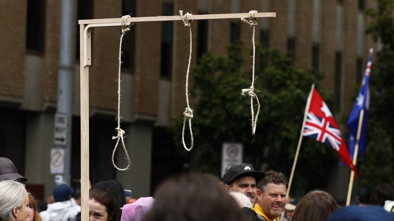 Gallows with nooses at a rally in Melbourne on Saturday. Picture: NCA NewsWire/Daniel Pockett