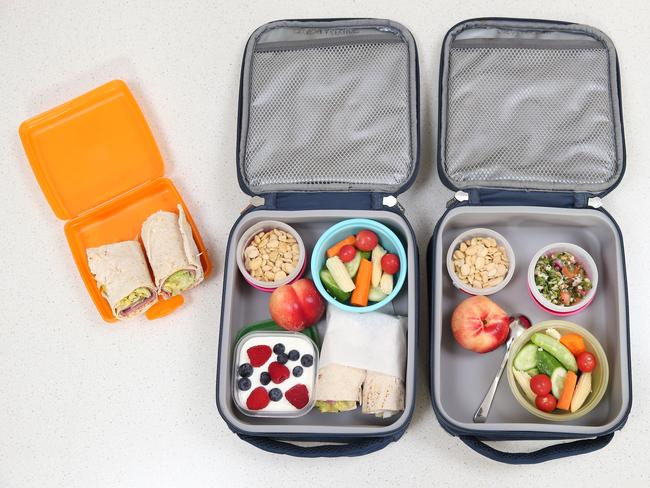 Rachel Clemons makes healthy lunch boxes for school that include beef lettuce and mustard wraps, Greek yoghurt and berries, fava beans and veggies. Picture: Richard Dobson 