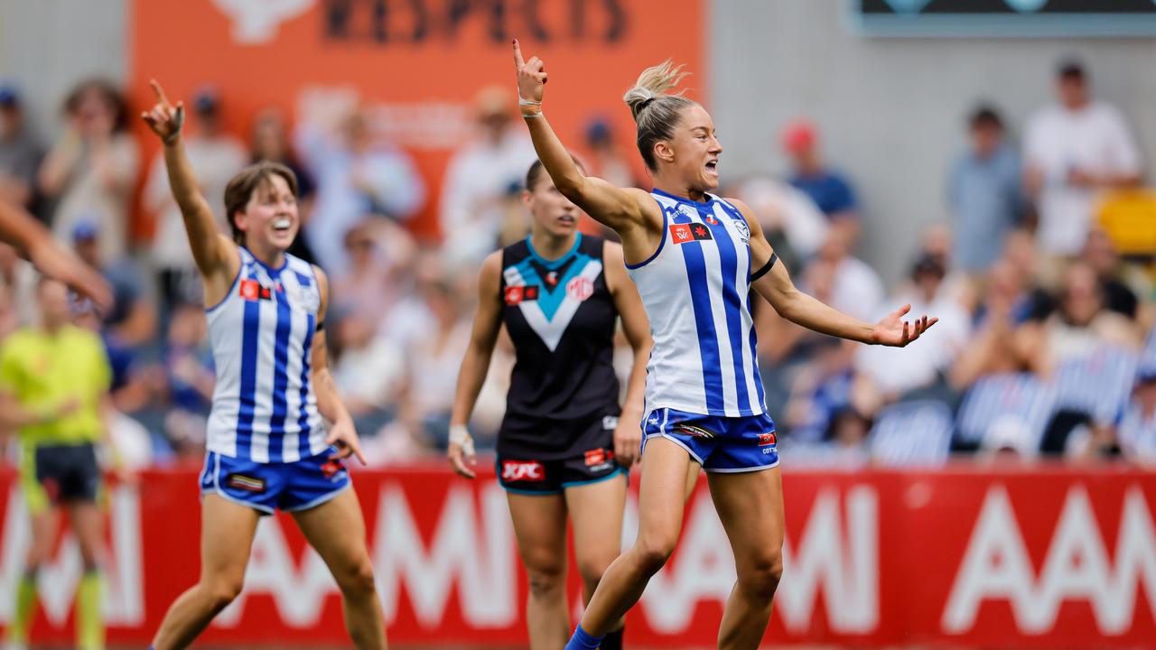 MELBOURNE, AUSTRALIA - NOVEMBER 23: Alice O'Loughlin of the Kangaroos celebrates a goal during the 2024 AFLW First Preliminary Final match between the North Melbourne Tasmanian Kangaroos and the Port Adelaide Power at IKON Park on November 23, 2024 in Melbourne, Australia. (Photo by Dylan Burns/AFL Photos via Getty Images)