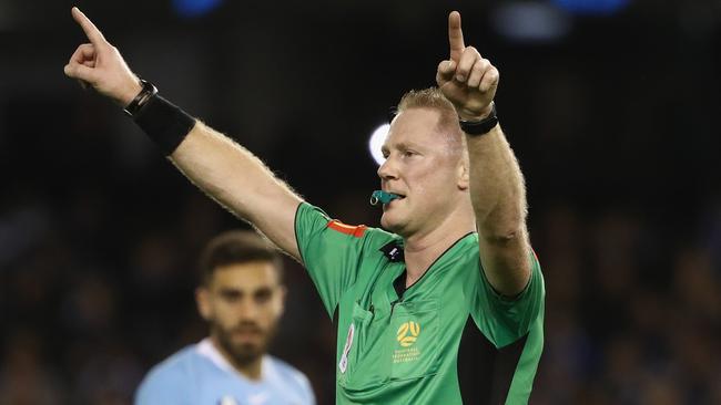 Referee Kurt Ams signals for the VAR during the A-League Melbourne derby.