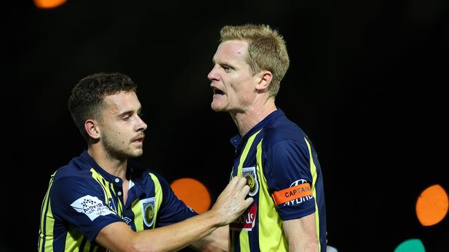 GOSFORD, AUSTRALIA - FEBRUARY 22: Matt Simon of the Central Coast Mariners is restrained by teammate Jordan Murray after getting sent off during the Round 20 A-League Match between the Central Coast Mariners and Brisbane Roar FC at Central Coast Stadium on February 22, 2019 in Gosford, Australia. (Photo by Tony Feder/Getty Images)