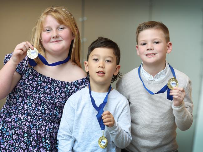 Twenty-one outstanding new Junior Triple Zero Heroes will be recognised for their exceptional courage and maturity while calling Triple Zero (000).  Junior Triple Zero Heroes Jorja Gardiner 8, Ace Cope 6 and Miles Taylor 7 with their medals.                     Picture: David Caird