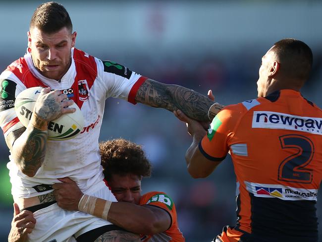 Josh Dugan of the Dragons is tackled.