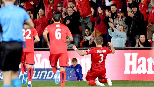 Scott Galloway of United hams it up for Reds fans after his first half goal against Sydney FC. Picture: AAP Image/Sam Wundke