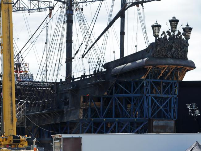 Pirates of the Caribbean on the Coast: Set builders at Helensvale work on creating a battered Black Pearl. Picture: Tim Marsden