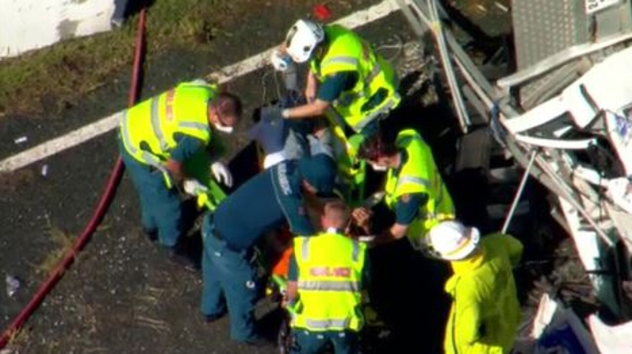 A truck driver has been rescued from his vehicle following a crash in Brisbane this morning. Picture: Jordan Fabris/Twitter