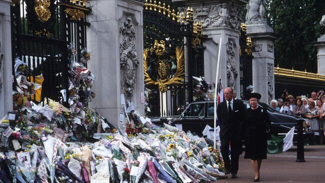 The Queen and the Duke of Edinburgh view tributes to Diana, Princess of Wales, left by the public outside Buckingham Palace in September 1997. Picture: John Shelley Collection/Avalon/Getty Images/The Times