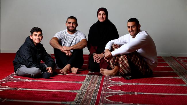 Adam Saad in his time on the Gold Coast, mother Nejme and brothers Noah, then 13, and Muhammad, then 18. Picture: Adam Head