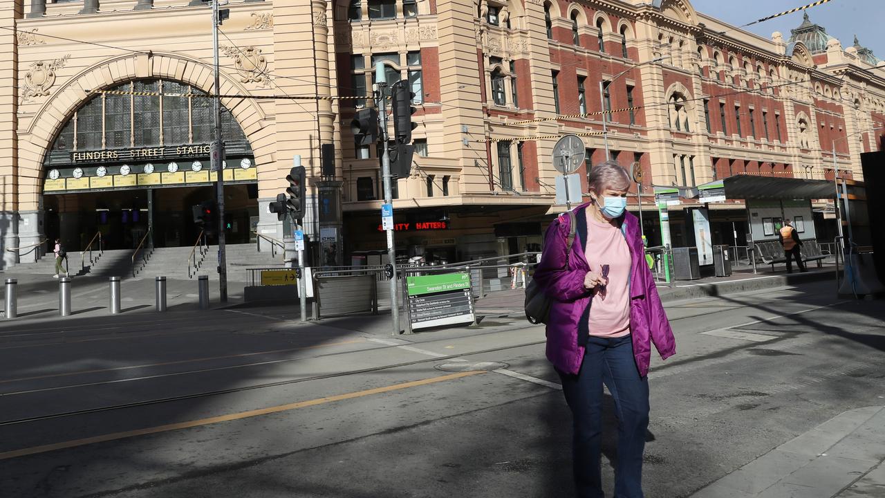 Flinders street station during day one of the stage four lockdown in Melbourne where people must have a work permit to be out on the roads. Picture: NCA NewsWire / David Crosling