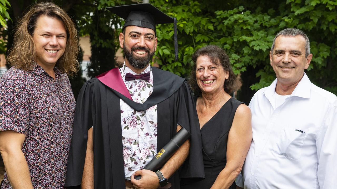 Bachelor of Spatial Science Technology (Surveying) graduate Brendon Hellmund is congratulated by (from left) Matthew Painter, Mary Cachie and Michael Hellmund at the UniSQ graduation ceremony at Empire Theatres, Tuesday, December 13, 2022. Picture: Kevin Farmer