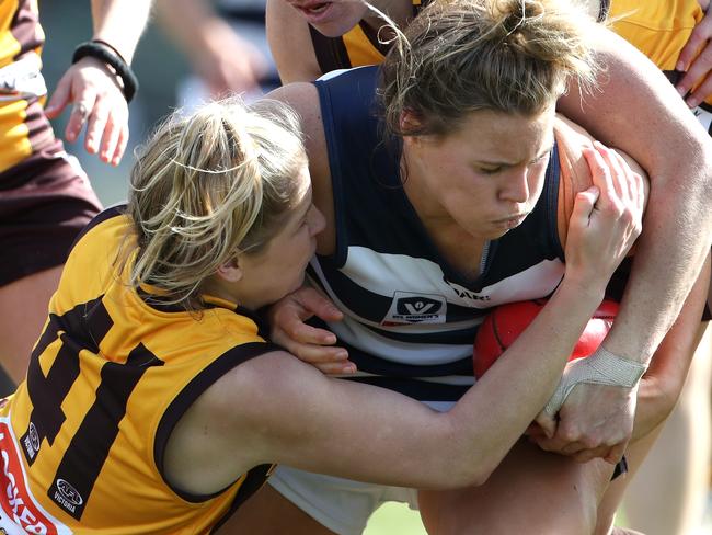 Kristy Stratton and Emma Mackie of the Hawks tackle Hayley Trevean of the Cats during the  VFL Womens match between Box Hill and Geelong played at Box Hill City Oval on Saturday 5th August, 2017. Picture: Mark Dadswell