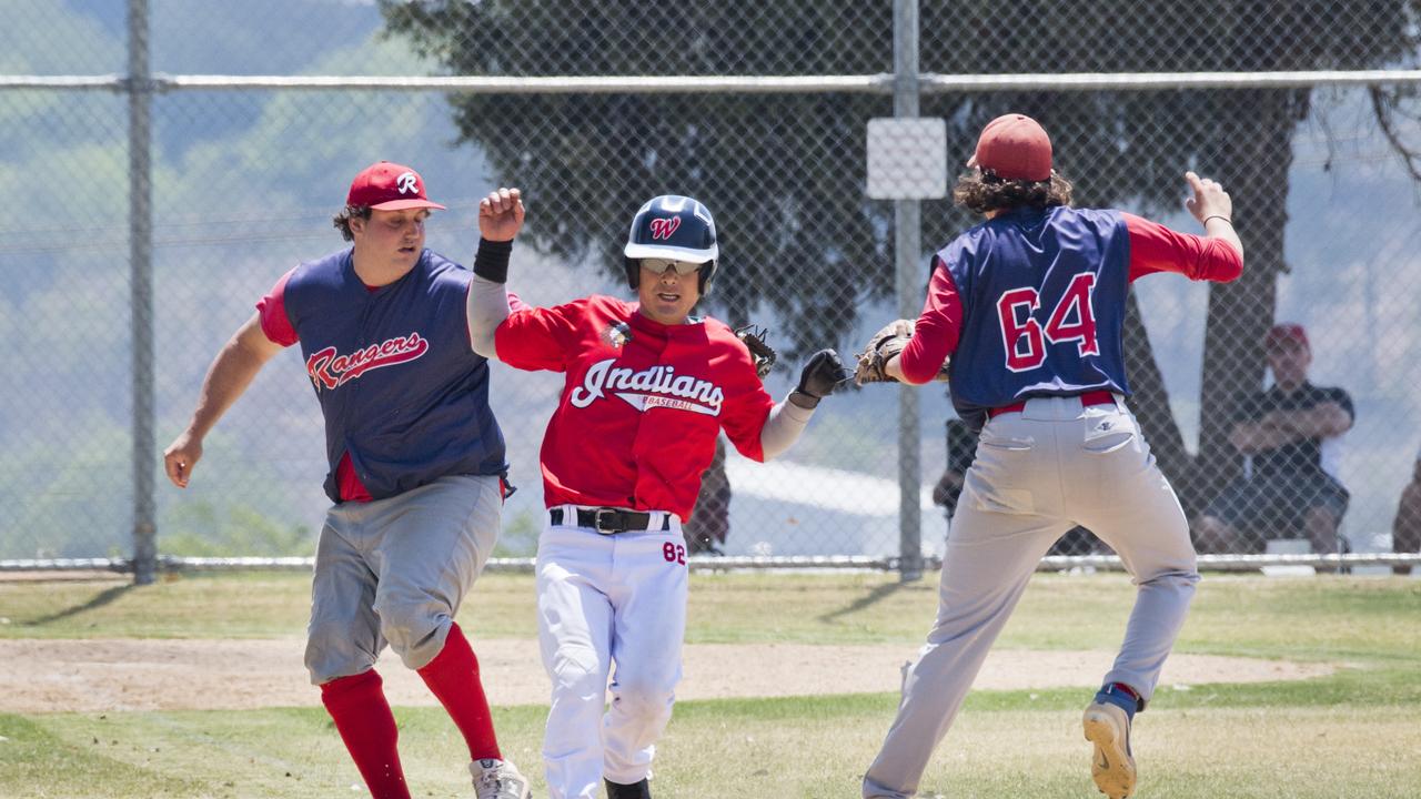 Taewoo Kim of Indians is tagged out by Ranger’s pitcher Lawrence Taylor during their GBL Division 4 round-11 clash last Sunday at Commonwealth Oval. Picture: Nev Madsen.