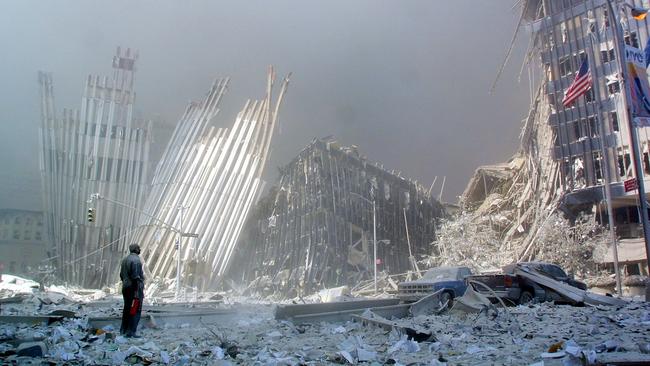 A man stands in the rubble and calls out asking if anyone needs help after the collapse of the first World Trade Centre tower. Picture: AFP