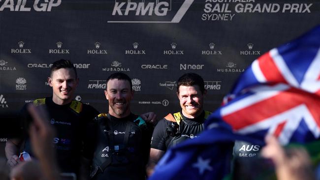 Australia driver Tom Slingsby (R) celebrates victory with teammates.