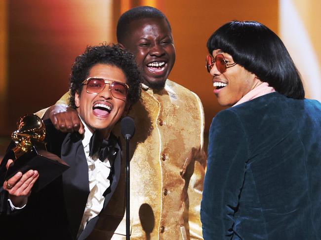 Bruno Mars, Dernst Emile II, and Anderson Paak accept the Song Of The Year award for Leave The Door Open. Picture: Getty Images