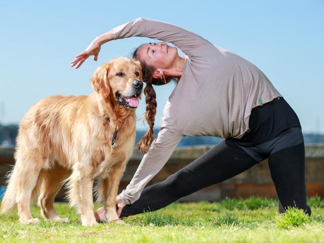 Yoga teacher and dog sitter Ann Repp Olsen with Sammy at Baere Park in Elisabeth Bay. Picture: Justin Lloyd