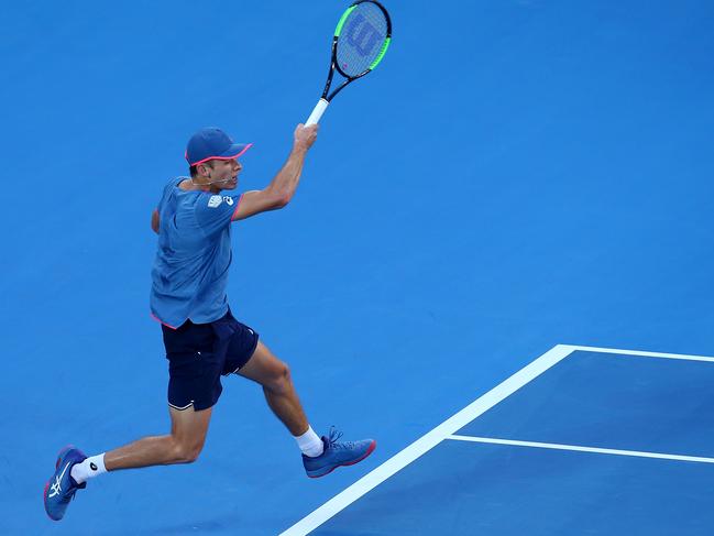 Alex De Minaur plays a shot from the back of the court against Dusan Lajovic.