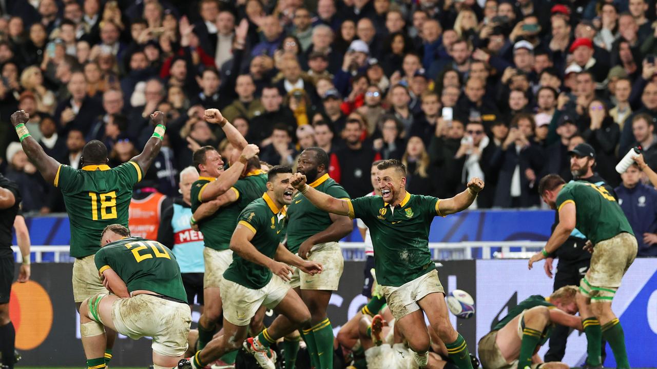 Handre Pollard celebrates with teammates following South Africa’s epic victory.