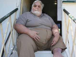 Koongal resident Joel Adams sits in his doorway pondering his future after his father’s house is sold.