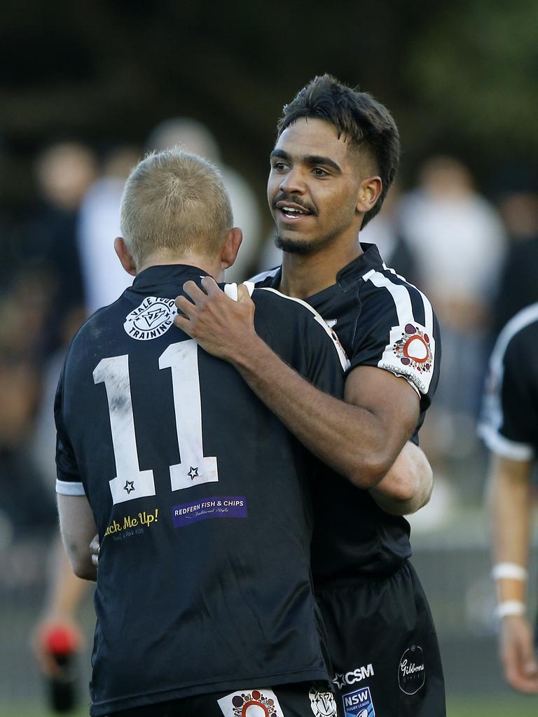 Redfern's Jay Belgrove and TJ Speedy Coe celebrate the try that clenched the match for Redfern. Picture: John Appleyard