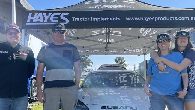 The Hayes family stand in front of their #23 Hayes Tractor Implements Subaru BRZ at Gympie Racecourse on July 21, 2023.