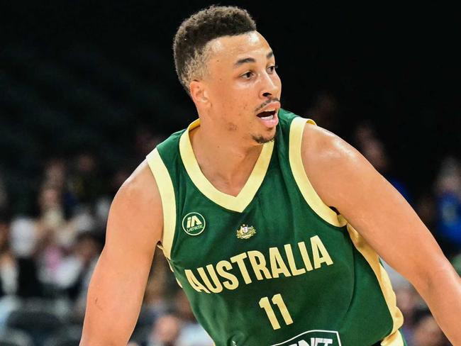 Australia's guard #11 Dante Exum is marked by Serbia's guard #30 Aleksa Avramovic during the Basketball Showcase friendly match between Serbia and Australia at Etihad Arena in Abu Dhabi on July 16, 2024. (Photo by Giuseppe CACACE / AFP)