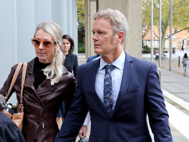 Craig McLachlan and his partner Vanessa Scammell pictured leaving the Supreme Court, Sydney CBD. Picture: Damian Shaw