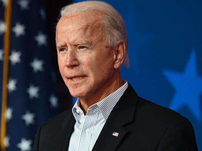 (FILES) In this file photo taken on November 5, 2020 Democratic Presidential candidate Joe Biden speaks as US Senator and Vice-Presidential candidate, Kamala Harris, looks on at the Queen venue in Wilmington, Delaware. - US President-elect Joe Biden and Vice President-elect Kamala Harris have been chosen as Time magazine's 2020 "Person of the Year," the publication announced on December 10, 2020. (Photo by JIM WATSON / AFP)