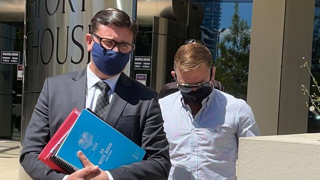 Mitchell Anthony Ralston (right) leaves Southport Court with his lawyer Michael Gatenby, of Gatenby Criminal Lawyers during his 2021 cabbie bashing matter. Picture: Lea Emery